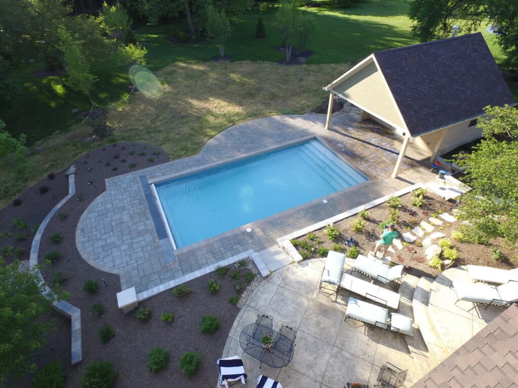 Unilock permeable pavers were used around the pool and pool house for this project in Tipp City.